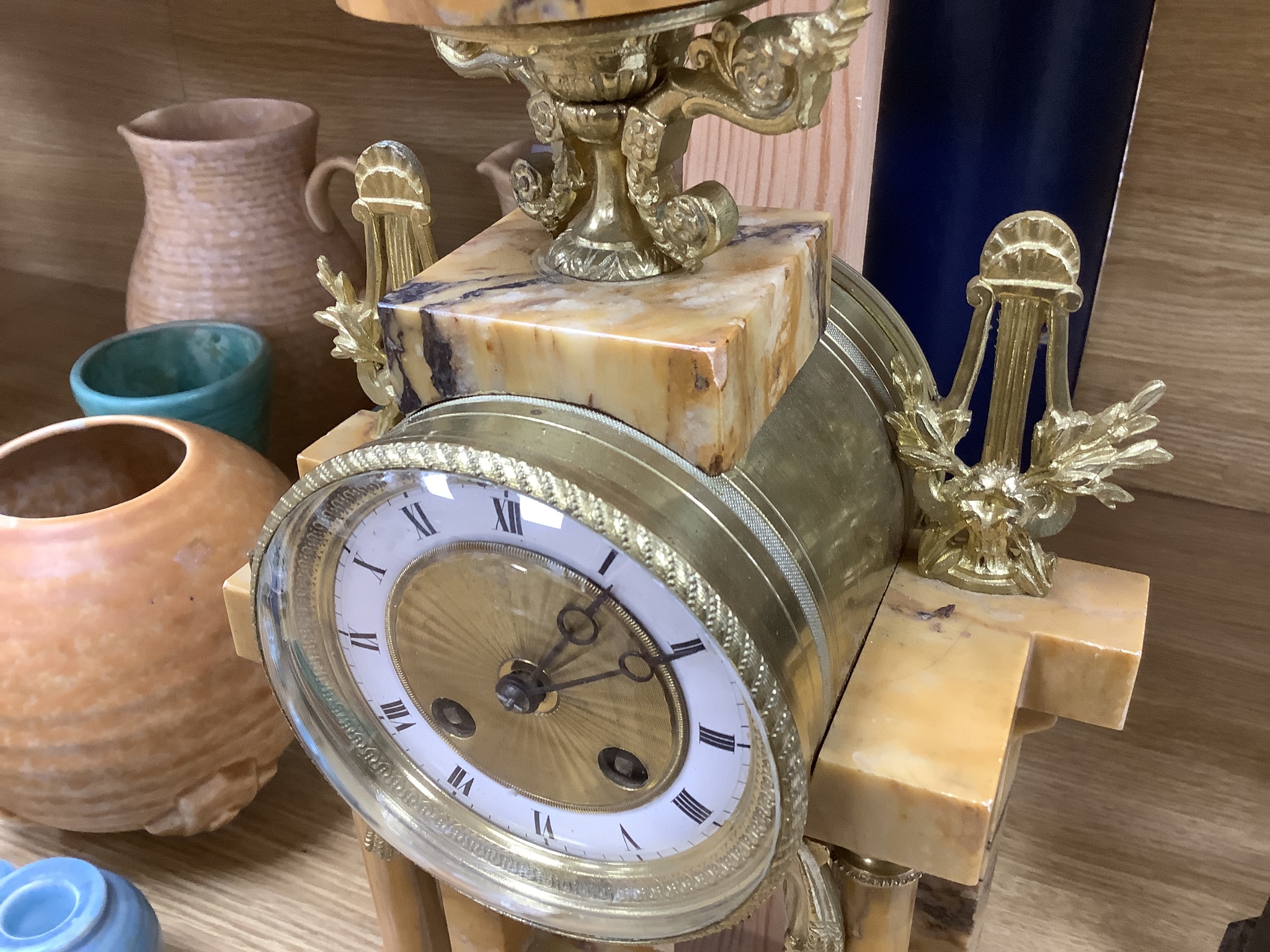 A 19th century French marble and gilt metal mantel clock, with key and pendulum, height 42.5cm